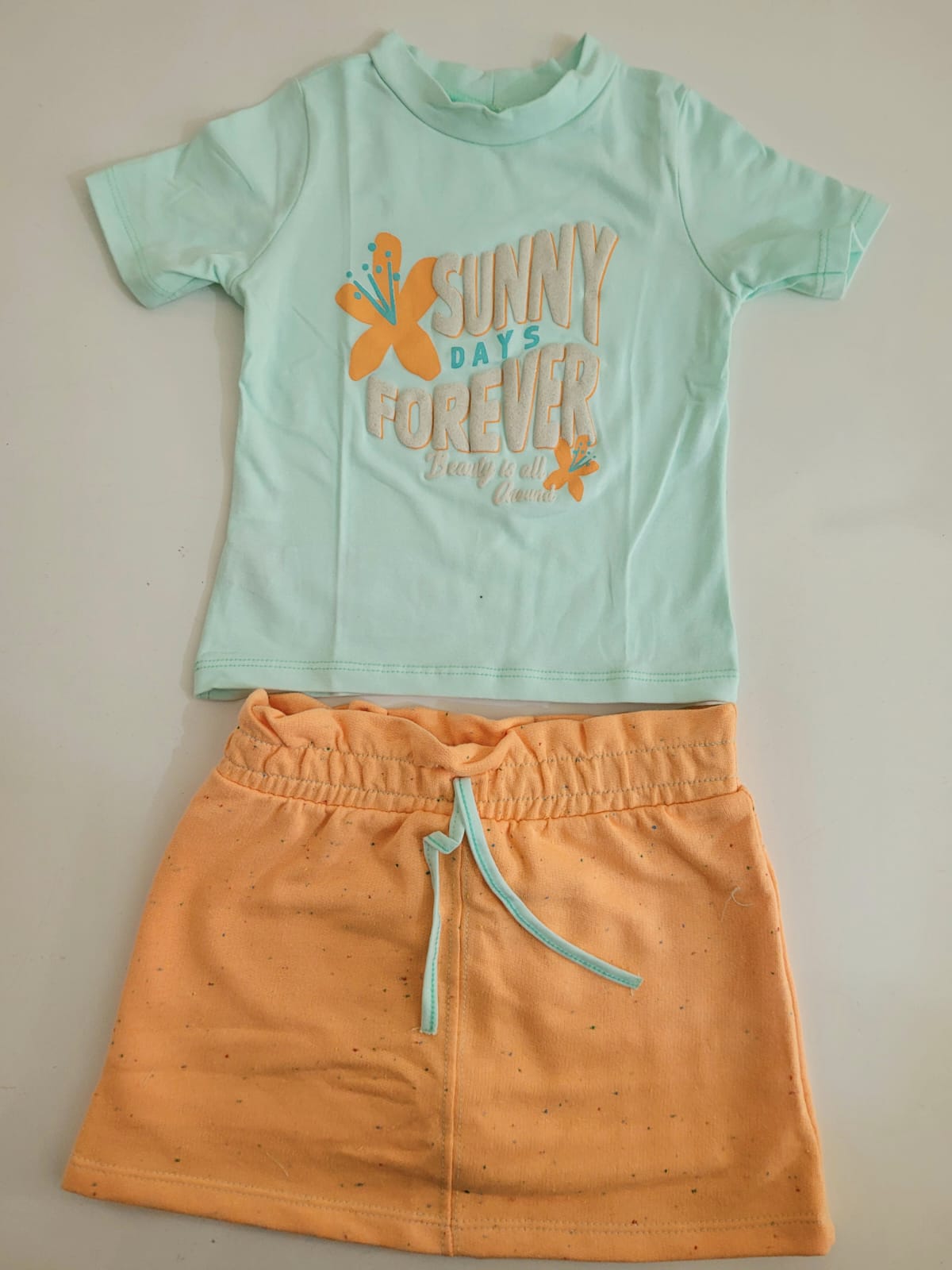 Conjunto blusa e saia com shorts em baixo verde claro Malwee